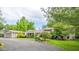 Beautiful home with a spacious driveway, detached garage and well-manicured landscaping at 140 Meridian Hills Blvd, Indianapolis, IN 46260