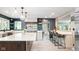 Modern kitchen featuring a large island with quartz countertops and stylish pendant lighting at 140 Meridian Hills Blvd, Indianapolis, IN 46260