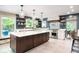 Bright kitchen featuring a large island, stainless steel appliances, and ample natural light at 140 Meridian Hills Blvd, Indianapolis, IN 46260