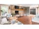 Inviting living room featuring a stone fireplace and hardwood floors, perfect for cozy evenings and relaxation at 140 Meridian Hills Blvd, Indianapolis, IN 46260