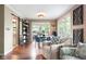 Open-concept living room with hardwood floors, seamlessly connecting to the dining area and offering a spacious feel at 140 Meridian Hills Blvd, Indianapolis, IN 46260