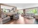 Bright living room with hardwood floors and large windows offering great natural light and an inviting atmosphere at 140 Meridian Hills Blvd, Indianapolis, IN 46260
