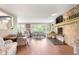 Bright living room with a stone fireplace, hardwood floors, and lots of natural light at 140 Meridian Hills Blvd, Indianapolis, IN 46260