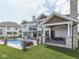 Backyard includes a refreshing pool, covered patio with outdoor seating, perfect for enjoying the outdoors and entertaining at 14464 Gainesway Cir, Fishers, IN 46040