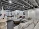 Spacious finished basement with stairs, and large comfortable seating area at 14464 Gainesway Cir, Fishers, IN 46040