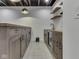 Basement bar with cabinetry, wooden countertop, and drink fridge at 14464 Gainesway Cir, Fishers, IN 46040