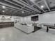 Finished basement featuring a large sectional couch, bar, and entertainment area at 14464 Gainesway Cir, Fishers, IN 46040