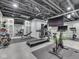 Finished basement featuring a home gym with treadmill, stationary bike, and weights at 14464 Gainesway Cir, Fishers, IN 46040