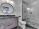 Updated bathroom features a glass shower, gray vanity, stylish mirror, and sleek fixtures at 14464 Gainesway Cir, Fishers, IN 46040