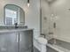 Modern bathroom with a tiled shower, granite countertop, and sleek vanity at 14464 Gainesway Cir, Fishers, IN 46040