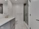 Modern bathroom featuring gray vanity, stylish mirror, glass shower door, and black shower accents at 14464 Gainesway Cir, Fishers, IN 46040