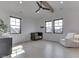 Light-filled bedroom with three windows, a crib, chair, dresser, and wooden beam on the ceiling at 14464 Gainesway Cir, Fishers, IN 46040