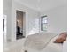 Inviting bedroom with ensuite bathroom view, featuring hardwood floors and natural light at 14464 Gainesway Cir, Fishers, IN 46040