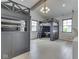 Unique bedroom boasts custom bunk beds with integrated desk space and a hanging chair at 14464 Gainesway Cir, Fishers, IN 46040