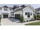 This home has modern farmhouse charm with its white siding, black accents and 3-car garage at 14464 Gainesway Cir, Fishers, IN 46040