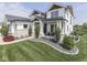 Beautiful two-story home with stone accents, lush lawn, and decorative landscaping at 14464 Gainesway Cir, Fishers, IN 46040