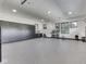 Large garage with overhead lighting and storage is perfect for storing vehicles, tools, and equipment, and maintaining an organized space at 14464 Gainesway Cir, Fishers, IN 46040