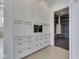Hallway with custom built-in cabinetry, a beverage fridge, and access to a mudroom at 14464 Gainesway Cir, Fishers, IN 46040