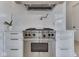 Close-up of a stainless steel gas range and oven against a white backsplash and cabinetry at 14464 Gainesway Cir, Fishers, IN 46040