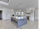 Bright and airy kitchen with a large island, pendant lighting, and professional-grade appliances at 14464 Gainesway Cir, Fishers, IN 46040