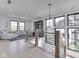Bright open-concept living room with natural light and a view of the neighborhood at 14464 Gainesway Cir, Fishers, IN 46040