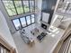Airy living room with soaring ceilings, expansive windows, and a modern design, offering stunning views and a spacious atmosphere at 14464 Gainesway Cir, Fishers, IN 46040