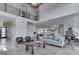 Open-concept living room with a view of the kitchen, with modern furnishings, and a bright, airy atmosphere at 14464 Gainesway Cir, Fishers, IN 46040