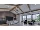 This primary bedroom features vaulted ceilings, exposed wood beams, and black-trimmed windows at 14464 Gainesway Cir, Fishers, IN 46040