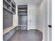 Well-organized mudroom with custom cabinetry, bench seating, and convenient storage solutions at 14464 Gainesway Cir, Fishers, IN 46040