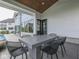 Covered outdoor living space with view of pool and backyard of home at 14464 Gainesway Cir, Fishers, IN 46040