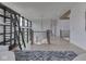 A second-floor view shows a laddered shelf, railing, and chandelier with light hardwood floors at 14464 Gainesway Cir, Fishers, IN 46040