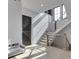 Bright staircase featuring light wood steps, modern railings, and natural light, creating an inviting and stylish home entry at 14464 Gainesway Cir, Fishers, IN 46040