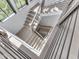 This modern staircase features hardwood stairs and black metal railings with natural light at 14464 Gainesway Cir, Fishers, IN 46040