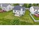 Aerial view of the home showing a spacious backyard with a concrete patio for outdoor enjoyment at 14542 Baldwin Ln, Carmel, IN 46032