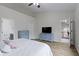 Spacious bedroom with luxury vinyl plank floors and access to a bathroom and hallway at 14542 Baldwin Ln, Carmel, IN 46032