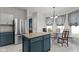 Open-concept kitchen with granite counters, stainless steel appliances, and a cozy breakfast nook nearby at 14542 Baldwin Ln, Carmel, IN 46032