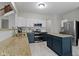 Well-lit kitchen with granite countertops, stainless steel appliances, and a functional center island at 14542 Baldwin Ln, Carmel, IN 46032