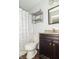Bathroom with a granite vanity, a large mirror, and a shower with a decorative curtain at 156 N Eastern Village Dr, Greenfield, IN 46140