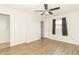 Bedroom featuring a ceiling fan, dark wood floors, and a window with natural light at 156 N Eastern Village Dr, Greenfield, IN 46140
