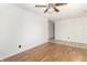 Bright bedroom features hardwood floors and a ceiling fan at 156 N Eastern Village Dr, Greenfield, IN 46140