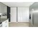 Bright kitchen features granite countertops and stainless refrigerator at 156 N Eastern Village Dr, Greenfield, IN 46140