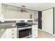 Kitchen provides stainless oven and granite countertops at 156 N Eastern Village Dr, Greenfield, IN 46140