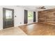 Inviting living room with a stylish wood accent wall and wood-look floors, brightened by natural light at 156 N Eastern Village Dr, Greenfield, IN 46140