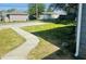 Wide backyard including a new sidewalk and a detached garage at 1718 Thaddeus St, Indianapolis, IN 46203
