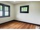 This bedroom offers natural light with dual windows and has ample space to create a comforting haven at 1718 Thaddeus St, Indianapolis, IN 46203