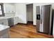 An updated kitchen is equipped with stainless steel appliances, new flooring and crisp white cabinets at 1718 Thaddeus St, Indianapolis, IN 46203