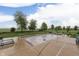 Lawn and partially covered inground pool in a large grassy backyard under cloudy skies at 1751 S Centennial Ave, New Palestine, IN 46163