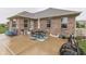 Spacious backyard patio with ample seating, perfect for outdoor gatherings and enjoying the serene surroundings at 1751 S Centennial Ave, New Palestine, IN 46163