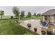 Expansive backyard featuring a swimming pool and patio, ideal for outdoor living and enjoying the lush landscape at 1751 S Centennial Ave, New Palestine, IN 46163