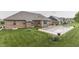 Backyard featuring a covered pool, lawn, and brick exterior of the home at 1751 S Centennial Ave, New Palestine, IN 46163